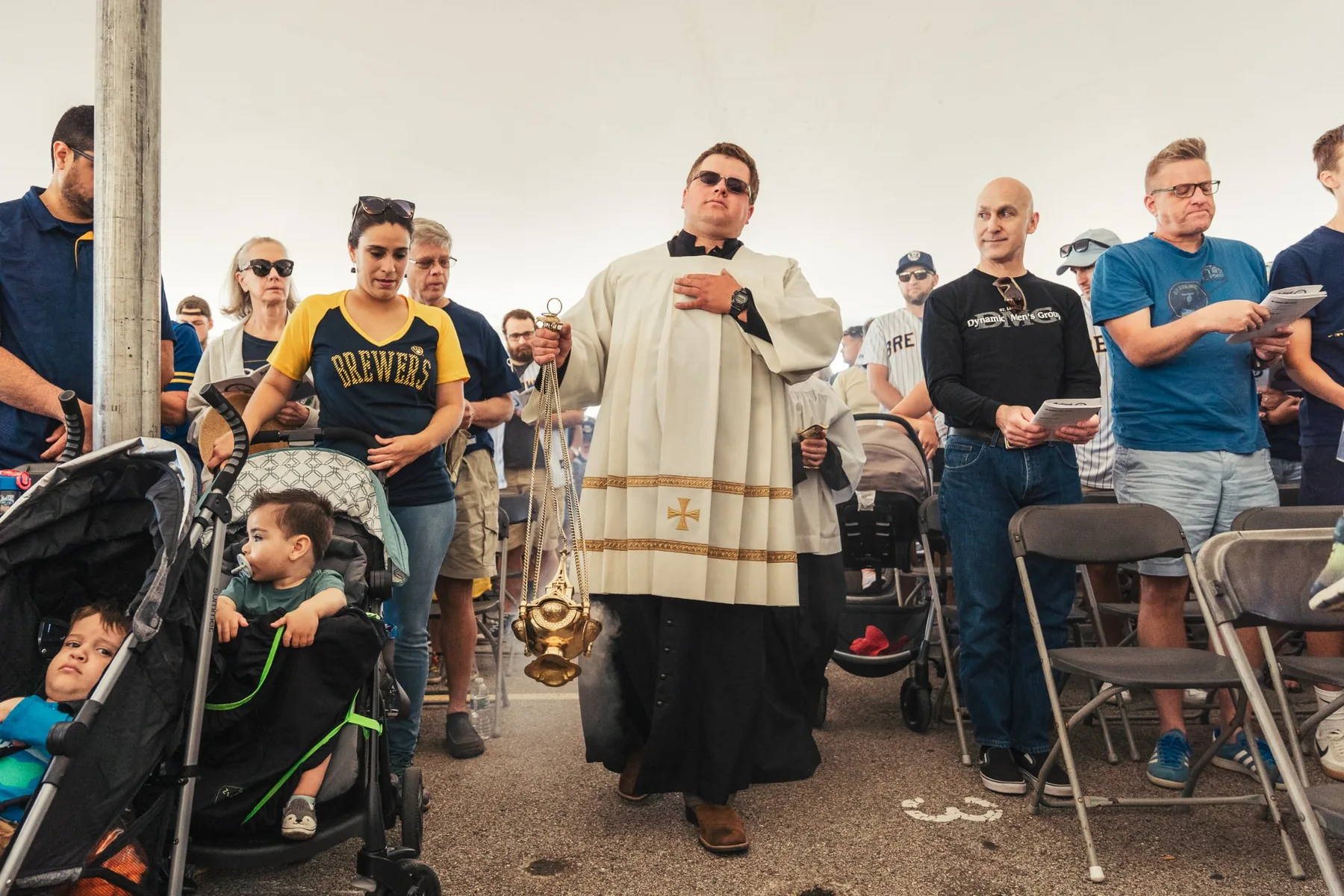 Incense procession during open-air Mass under the event tent