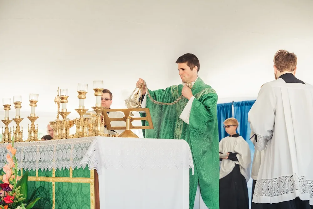 A young fan holding a Day of Faith program